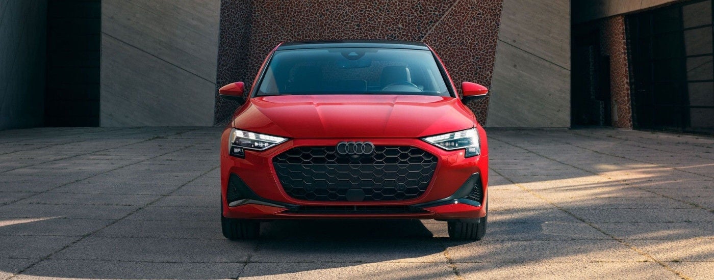 A red 2025 Audi A3 on a driveway after leaving an Audi dealer near you.